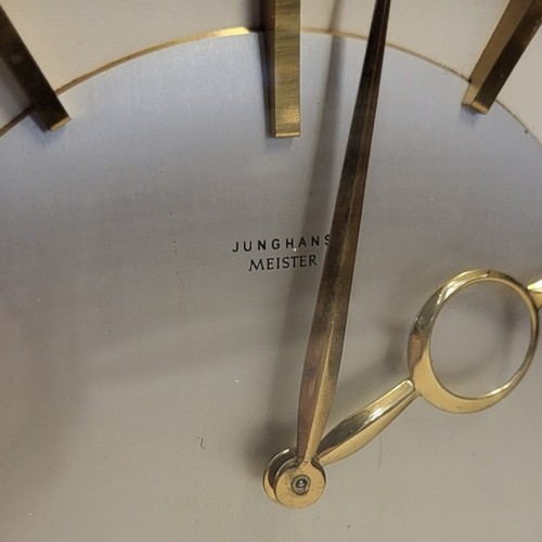 221B - JUNGHANS, A MID CENTURY GILT BRASS MANTLE CLOCK
Oval case with mechanical movement and arched base.
... 