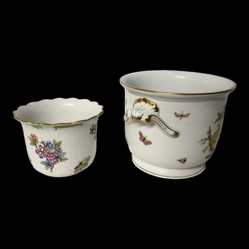 387 - HEREND, A PORCELAIN PLANTER
Decorated with birds and butterflies along with another smaller decorate... 