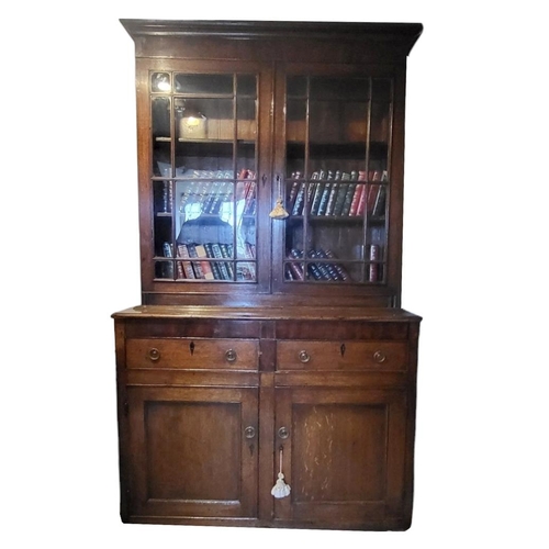 765 - A 19TH CENTURY OAK DRESSER
With two glazed doors above two drawers and cupboards.
(119cm x 45cm x 20... 