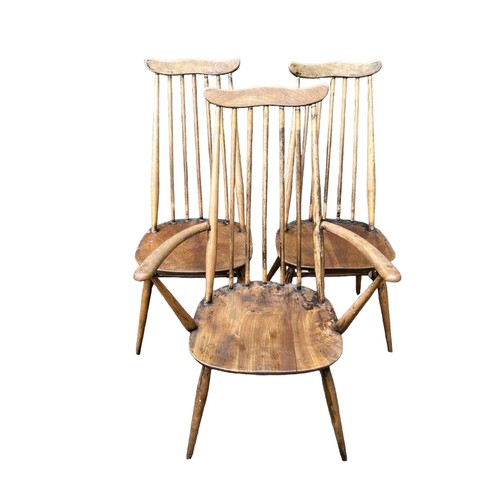 763 - THREE MID CENTURY ERCOL STICK BACK CHAIRS
With elm seats including one carver.
(61cm x 47cm x 96cm)
... 