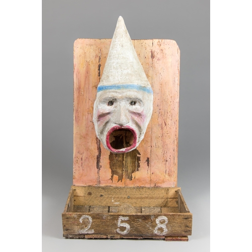 1 - AN EARLY 20TH CENTURY PAINTED PAPIER-MÂCHÉ FRENCH FAIRGROUND PASSÉ-BOULES BALL TOSS GAME.
In the for... 