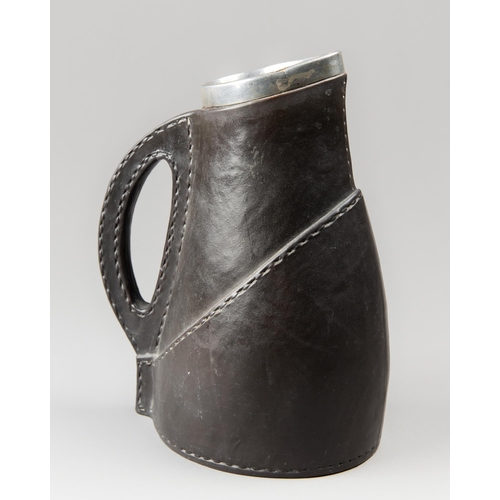 141 - A LATE 19TH CENTURY DOULTON LAMBETH LEATHER JACKET TANKARD WITH STERLING SILVER RIM. 
Silver Hallmar... 