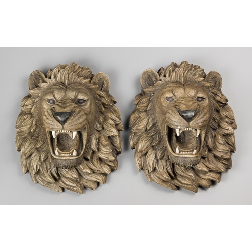 174 - A PAIR OF LATE 20TH CENTURY LION HEAD WALL PLAQUES.
Composite. (h 40cm x w 32cm x d 23cm)