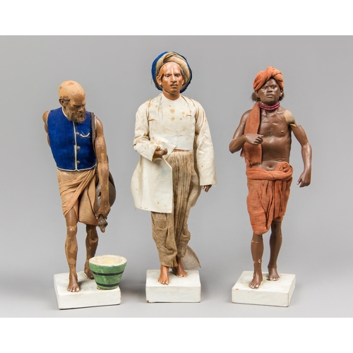 19 - A COLLECTION OF THREE 19TH CENTURY CLAY INDIAN FIGURES ATTRIBUTED TO JADUNATH PAL (1821-1920).
Made ... 