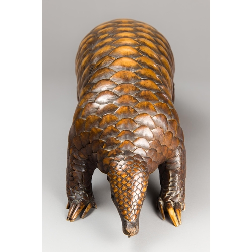 270 - A LARGE AND IMPRESSIVE LATE 19TH CENTURY TAXIDERMY PANGOLIN (PHOLIDOTA).
(h 22cm x w 89.5cm x d 22cm... 