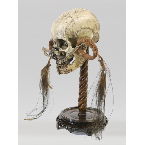 394 - A 19TH CENTURY SCIENTIFIC MEDICAL STUDY TRIBAL SKULL, ASMAT 