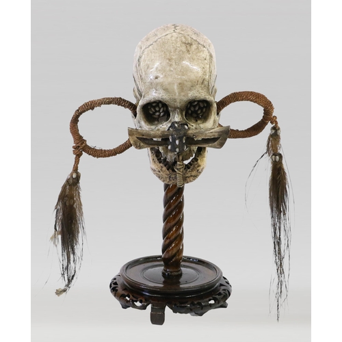 394 - A 19TH CENTURY SCIENTIFIC MEDICAL STUDY TRIBAL SKULL, ASMAT 