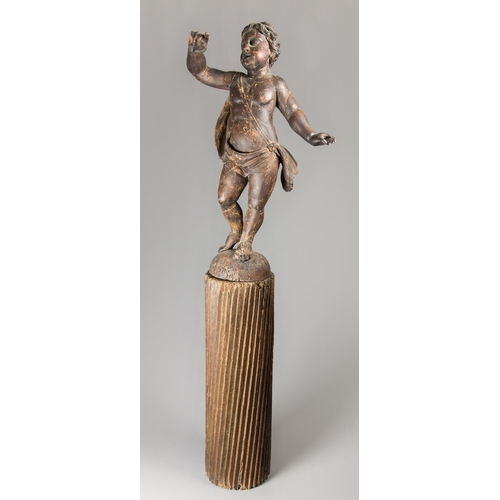 65 - A 17TH/18TH CENTURY CARVED WOOD PUTTI UPON A FLUTED COLUMN. (h 161cm)