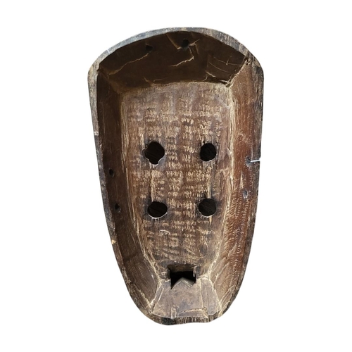 410 - AN AFRICAN TRIBAL CARVED WOODEN  GREBO 'KRU' MASK
Four eye holes, square mouth.
(approx 33cm)

Condi... 