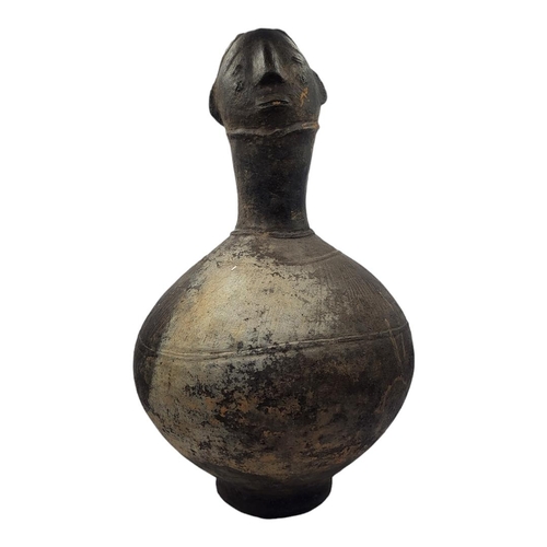 411 - AN AFRICAN AGNO POTTERY ANTHROPOMORPHIC VESSEL WITH HEAD FINIAL
Bulbous body with incised decoration... 