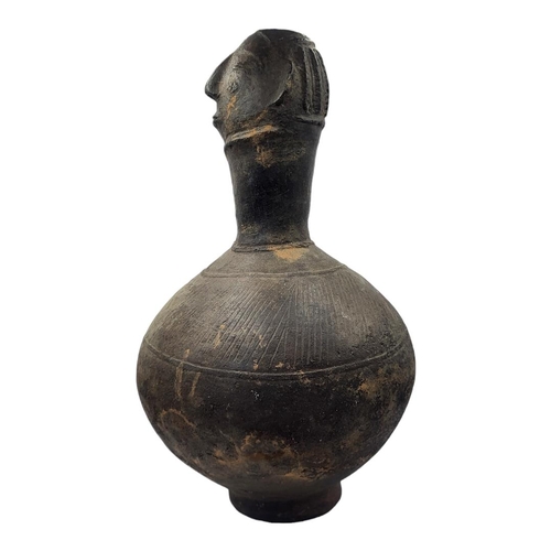 411 - AN AFRICAN AGNO POTTERY ANTHROPOMORPHIC VESSEL WITH HEAD FINIAL
Bulbous body with incised decoration... 