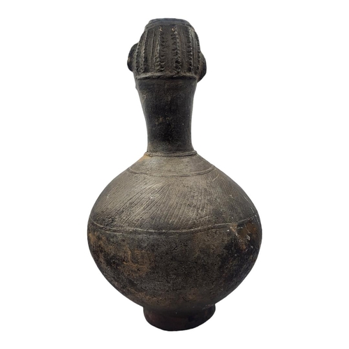 411 - AN AFRICAN AGNO POTTERY ANTHROPOMORPHIC VESSEL WITH HEAD FINIAL
Bulbous body with incised decoration... 