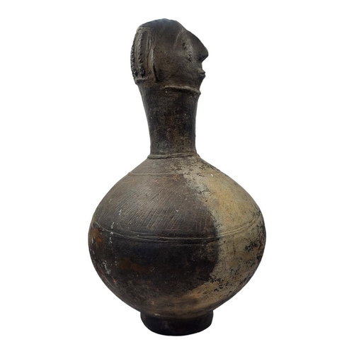 411 - AN AFRICAN AGNO POTTERY ANTHROPOMORPHIC VESSEL WITH HEAD FINIAL
Bulbous body with incised decoration... 