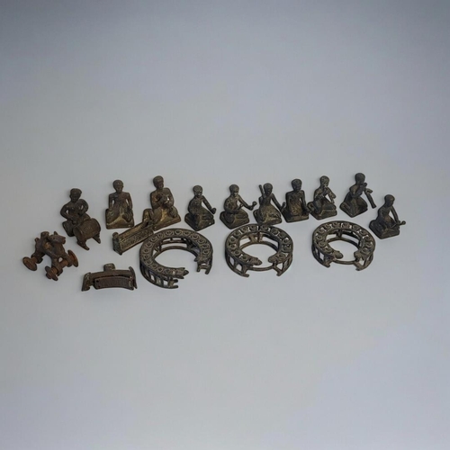 423 - A COLLECTION OF INDONESIAN CAST METAL GAMELAN ORCHESTRA FIGURES
Seated pose with instruments and app... 