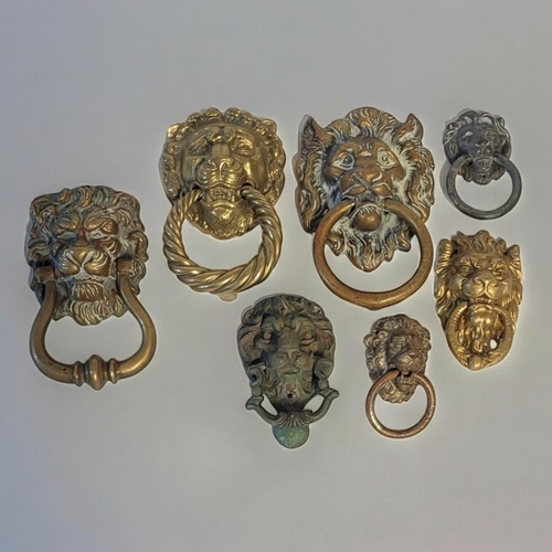 439 - A COLLECTION OF VINTAGE BRASS LION MASK DOOR KNOCKERS
To include a mask with rope twist knocker.
(la... 