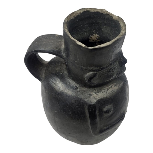 440 - A SOUTH AMERICAN POTTERY EROTIC FIGURAL JUG
Single handle with face mask and pot belly.
(approx 19cm... 