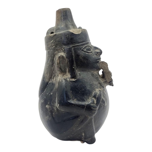 445 - A SOUTH AMERICAN POTTERY FIGURAL JUG
Cylindrical finial and playing pan pipes.
(approx 18cm)

Condit... 