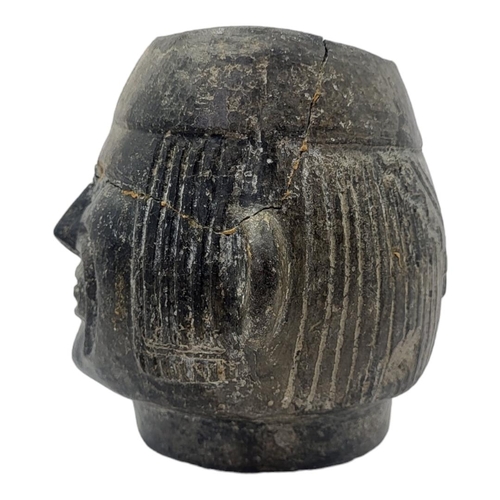 446 - A SOUTH AMERICAN POTTERY FIGURAL VESSEL
Having a grimacing face to body and reeds to headdress.
(app... 