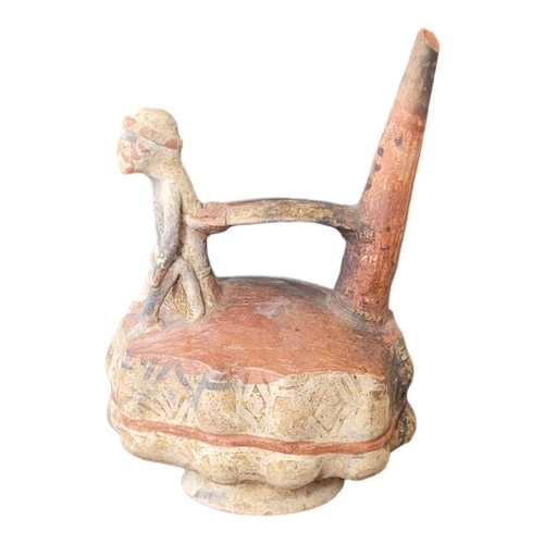 453 - A SOUTH AMERICAN POTTERY FIGURAL WHISTLING JAR 
Trumpet form handle with seated figure on serpentine... 