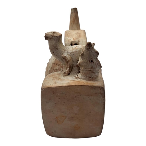 456 - A SOUTH AMERICAN TERRACOTTA POTTERY WHISTLING JAR
Trumpet form finial with seated figure with lama.
... 