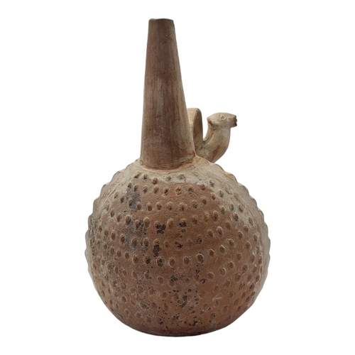 456 - A SOUTH AMERICAN TERRACOTTA POTTERY WHISTLING JAR
Trumpet form finial with seated figure with lama.
... 