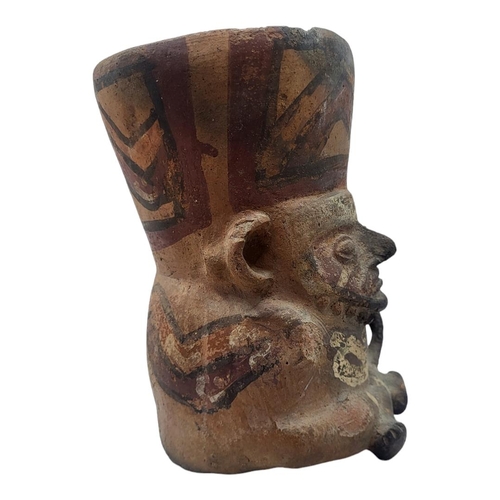 457 - A SOUTH AMERICAN TERRACOTTA POTTERY MASK JUG
Having facial mask, single handle with hand painted dec... 