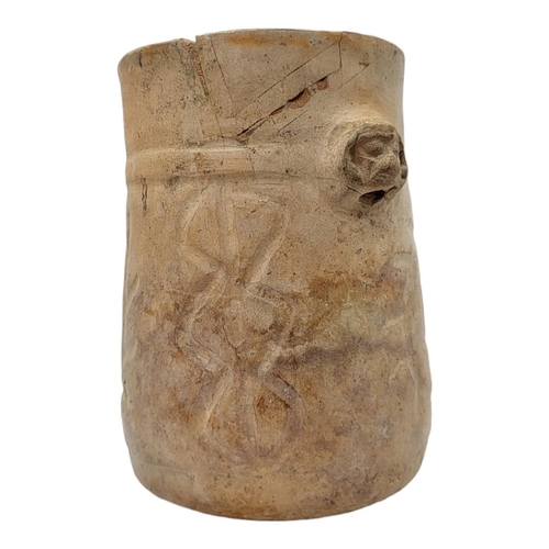 460 - A SOUTH AMERICAN TERRACOTTA POTTERY VASE
Having a single mask and incised decoration.
(approx 16cm)
... 