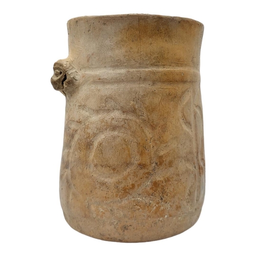 460 - A SOUTH AMERICAN TERRACOTTA POTTERY VASE
Having a single mask and incised decoration.
(approx 16cm)
... 