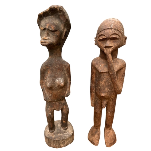 474 - TWO AFRICAN GHANA CARVED WOODEN FERTILITY FIGURES
Male and female in standing pose.
(approx 36cm)

C... 