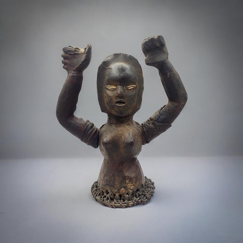 475 - AN AFRICAN EKOI TRIBE LEATHER FIGURE
Female form, with both arms raised and woven leather straps to ... 