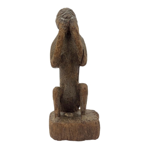 477 - AN AFRICAN CAMEROON CARVED WOODEN FIGURE
Seated pose with hands to mouth.
(approx 21cm)
 
Condition:... 