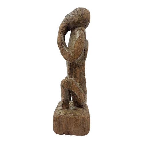 477 - AN AFRICAN CAMEROON CARVED WOODEN FIGURE
Seated pose with hands to mouth.
(approx 21cm)
 
Condition:... 