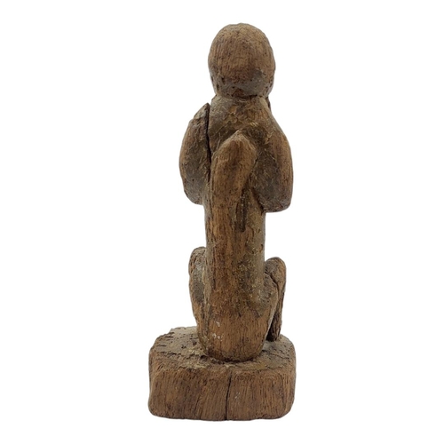 477 - AN AFRICAN CAMEROON CARVED WOODEN FIGURE
Seated pose with hands to mouth.
(approx 21cm)
 
Condition:... 