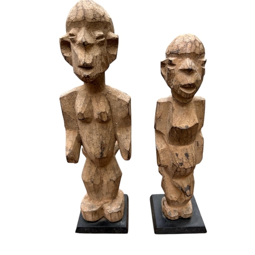 478 - A PAIR OF AFRICAN GHANA CARVED FERTILITY FIGURES, MALE AND FEMALE IN STANDING POSE
On square bases.
... 