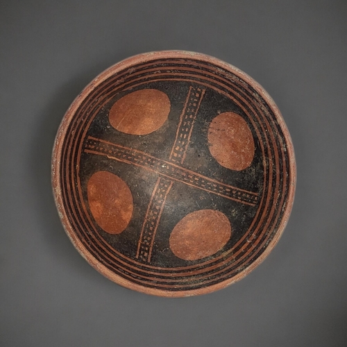 488 - A SOUTH AMERICAN TERRACOTTA POTTERY BOWL
Hand painted decoration with egg form designs to centre.
(a... 