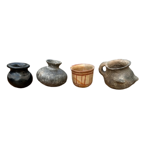 489 - A COLLECTION OF FOUR SOUTH AMERICAN POTTERY VESSELS
To include a terracotta pot with hand painted de... 