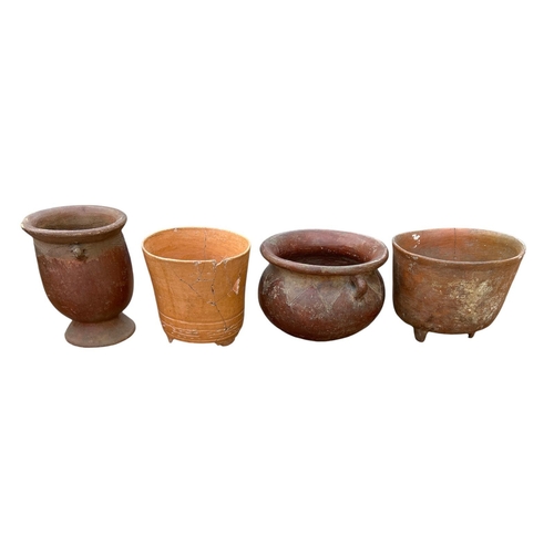 490 - A COLLECTION OF FOUR SOUTH AMERICAN POTTERY BOWLS
Two with handles and two with tripod legs.
(larges... 