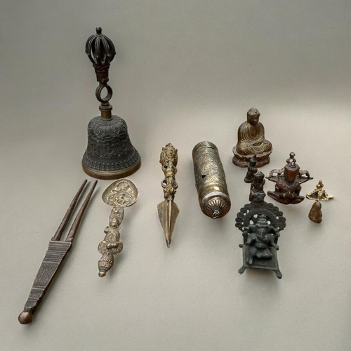 494 - A COLLECTION IF TIBETAN BRONZE AND BRASS BUDDHIST CEREMONIAL ITEMS
Comprising a ritual bell, Dorji, ... 