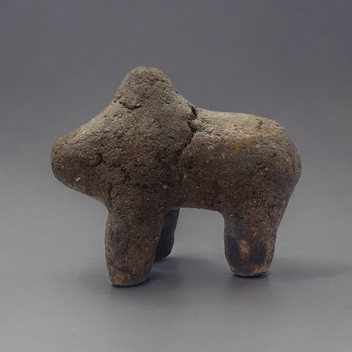 412 - AN AFRICAN EARTH AND ORGANIC MATERIAL 'BAMANA BOLI' FIGURE
Animal with hump in standing pose.
(appro... 