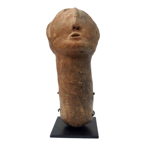 415 - AN AFRICAN TERRACOTTA BURA TRIBE FUNERARY SCULPTURE
Carved facial features on tapering base.
(approx... 