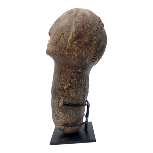 415 - AN AFRICAN TERRACOTTA BURA TRIBE FUNERARY SCULPTURE
Carved facial features on tapering base.
(approx... 