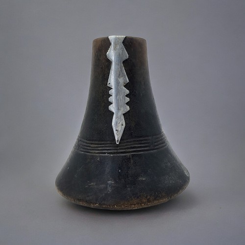 417 - AN AFRICAN CARVED WOODEN RWANDA TUTSI MILK JUG
Conical form with applied metallic mound and dome for... 