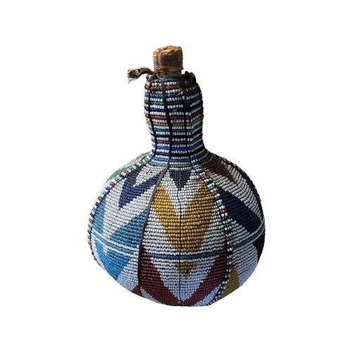 428 - A 20TH CENTURY AFRICAN BEADED GOURD BOTTLE
Having a colourful arrangement of glass beads with cork.
... 