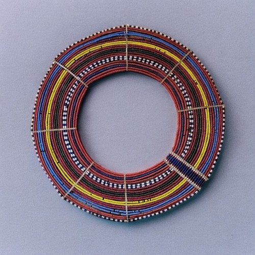 434 - AN AFRICAN TRIBAL MAASAI BEADWORK COLLAR
The arrangement of colourful glass beads forming concentric... 