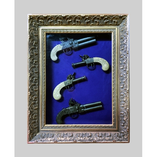 192B - A COLLECTION OF IMITATION ANTIQUE PISTOLS IN A GLAZED FRAMED CASE.
(h 55cm x w 43cm x d 9cm)