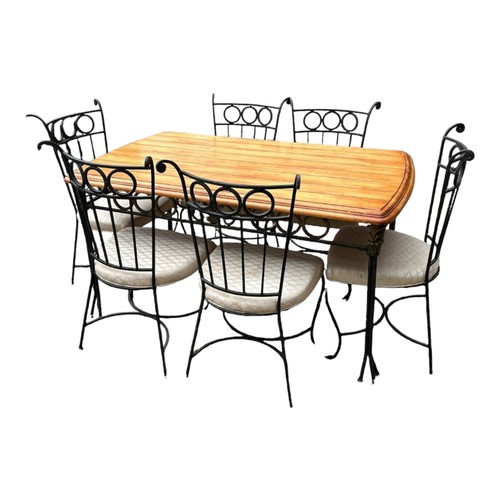 419 - A PINE AND WROUGHT IRON DINING TABLE
Complete with six matching chairs.

Condition: good overall, so... 