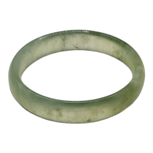 27A - A PALE GREEN CELADON JADE BANGLE.
(inside diameter 6cm)

Condition: good overall