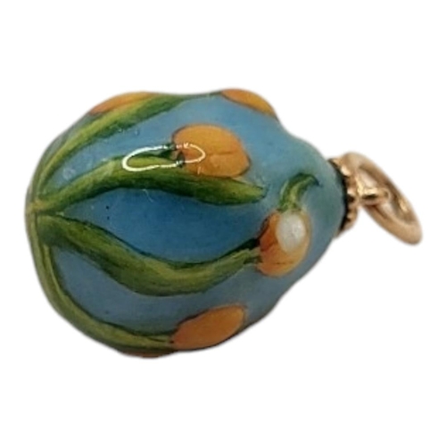 14A - A RUSSIAN GOLD AND EMERALD ENAMEL EGG PENDANT
With raised floral decoration and impressed with hallm... 