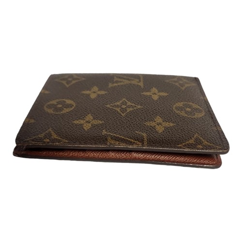 377 - LOUIS VUITTON, A BROWN LEATHER MONOGRAM WALLET
Card spaces and large note compartment, marked to int... 