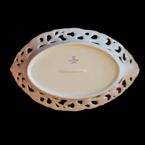 367 - A PAIR OF SEVRÈS STYLE CERAMIC OVAL DISHES
having a central floral decoration and pierced acanthus d... 